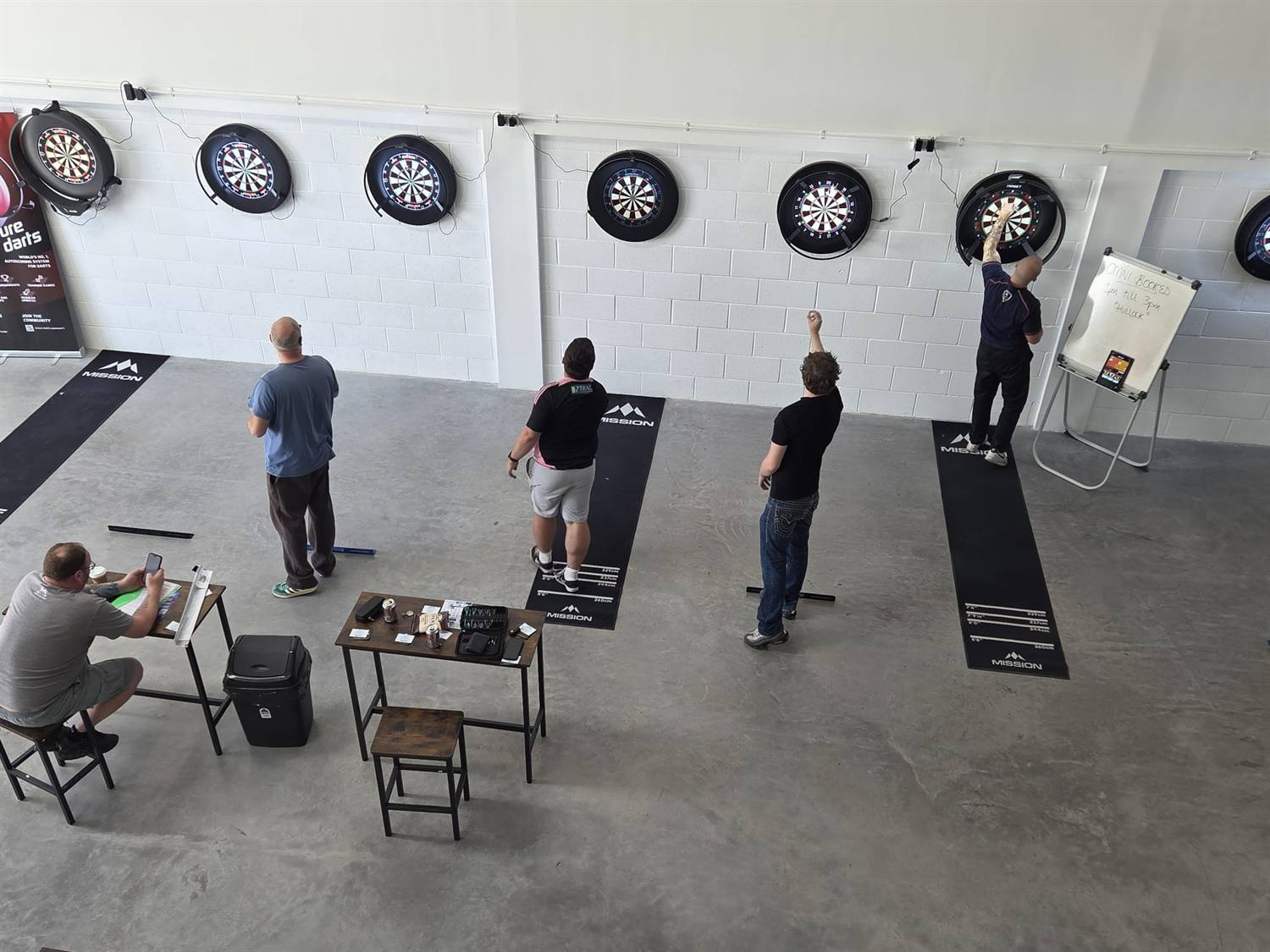 Players throwing across the main hall at Wiltshire Darts House, Swindon